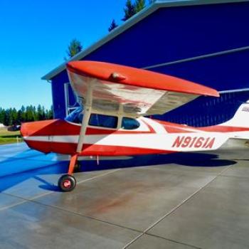 Cessna taildragger on airport tarmac